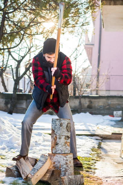 Man cutting firewood for the winter