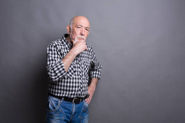 istock Pensive mature man looking at camera, copy space 843221850