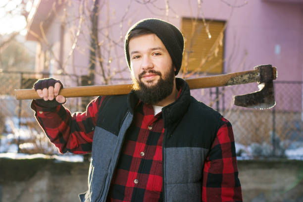 istock Masculine man with an axe for cutting firewood 843221908