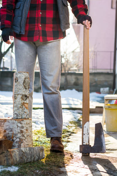 istock Masculine man with an axe for cutting firewood 843222168