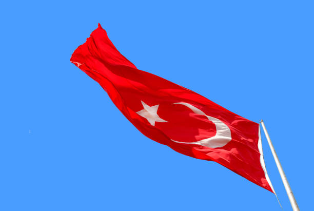 istock Waving Turkish flag on blue background 843229186