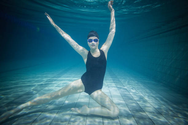 istock Pretty woman stretching underwater 843230592