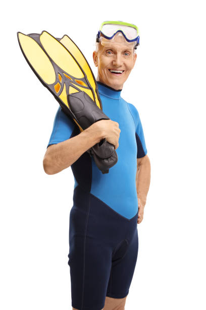 istock Senior in a wetsuit with snorkeling equipment 843231080