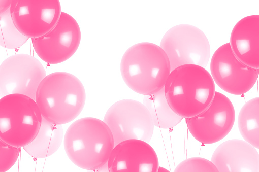 Pink party balloons on white background