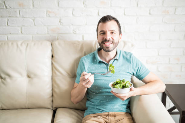 istock Healthy man enjoying a fresh salad 843237866
