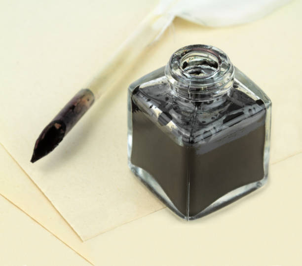 istock Quill pen, papers and ink bottle 843237986