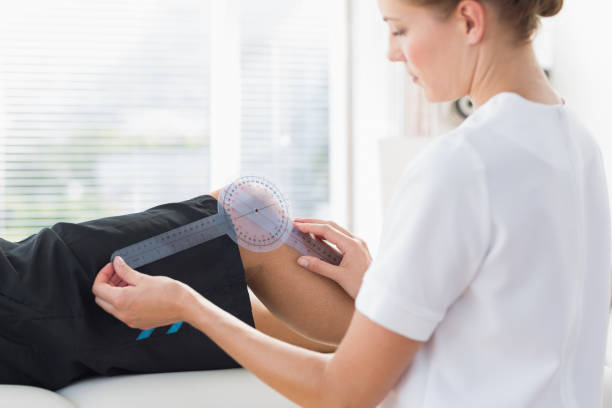istock Physiotherapist examining knee angle of man 843238628