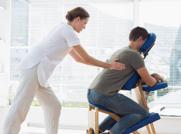 istock Man receiving back massage from physiotherapist 843241422