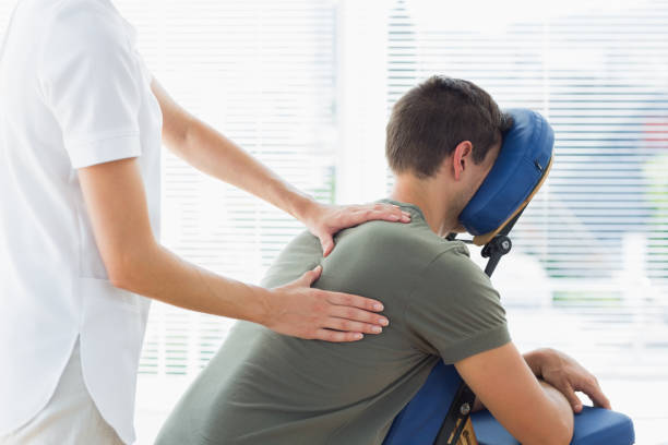 istock Physiotherapist giving massage to man 843241552