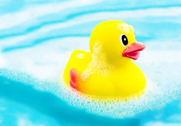istock Bath time and rubber duck in soap foam 843241954