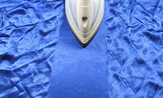 iron on blue crinkle silk fabric close up image
