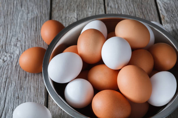 istock Fresh brown eggs in bowl on wood background 843249470