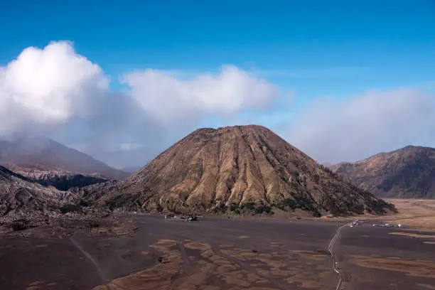 Mount Batok a volcano with clear blue sky at the Tengger Semeru National Park in East Java, Indonesia.