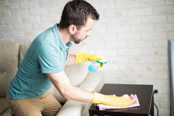 istock Latin man cleaning furniture 843252346