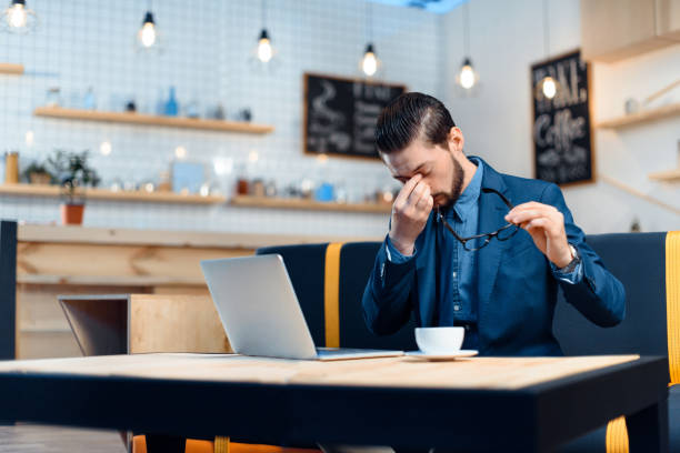 istock businessman using laptop in cafe 843252634