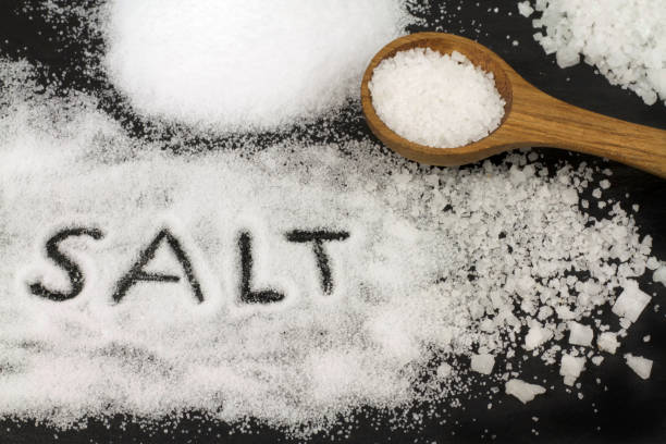 istock Salt and wooden spoon 843253154