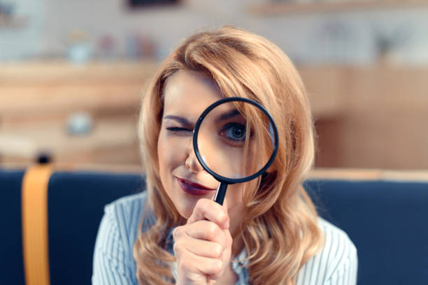 istock businesswoman with magnifier 843253208
