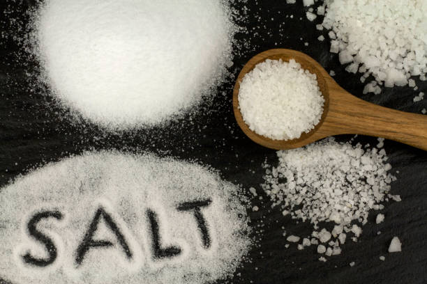 istock Salt and wooden spoon 843253238