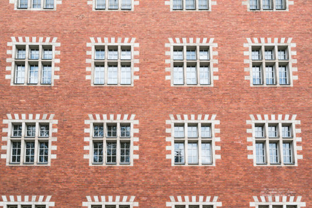 facade of an old house with red brick wall