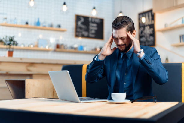 istock businessman using laptop in cafe 843253812