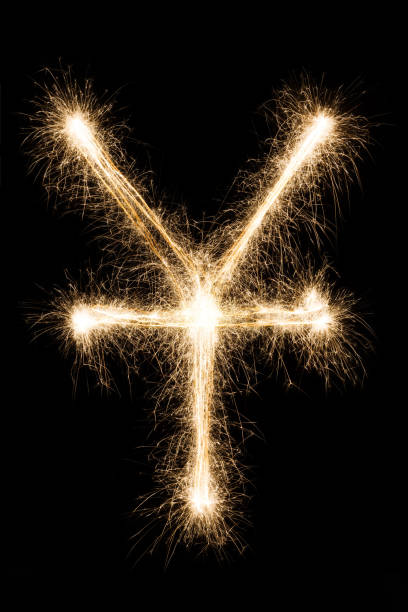 istock Sparkler yen symbol on black background 843256078