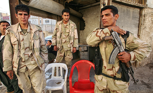 'Arbil, Iraq-December 05, 2005: Kurdish soldier stands guard in Arbil, Kurdistan, Iraq. They are called peshmerga in Iraq.'