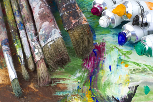istock Paint colors and brushes on artist palette 843257092