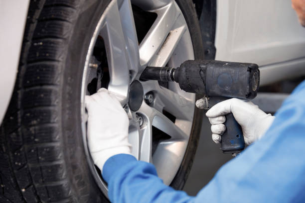 istock Tire repairer changing the car tire 843261120