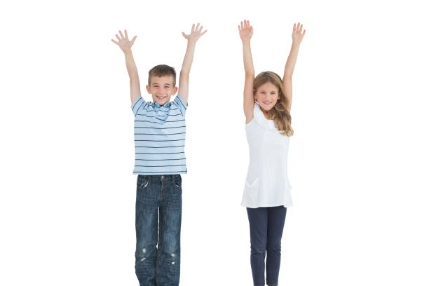 istock Happy young brother and sister cheering 843263592