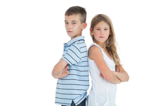 istock Serious young brother and sister posing back-to-back 843263678