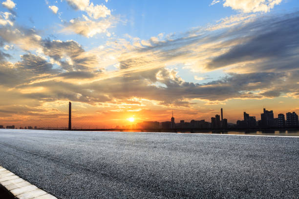 istock Asphalt highways and city buildings at sunset 843264244
