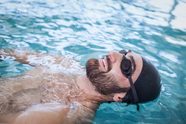 istock Fit man swimming on the back 843265476