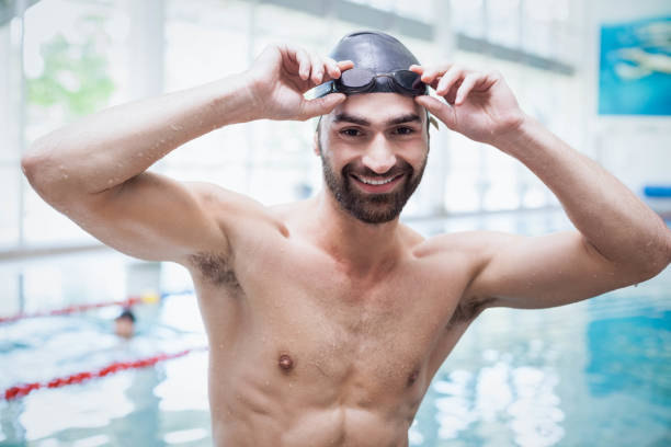 istock Fit man wearing swim cap and goggles 843265682