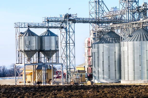 istock The complex silo installations for the storage of grain standing in the plowed 843266222