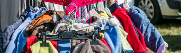 istock used child and baby clothes displayed on rack for exchange 843268876