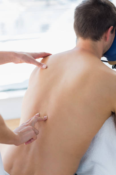 istock Man receiving back massage by therapist 843269960