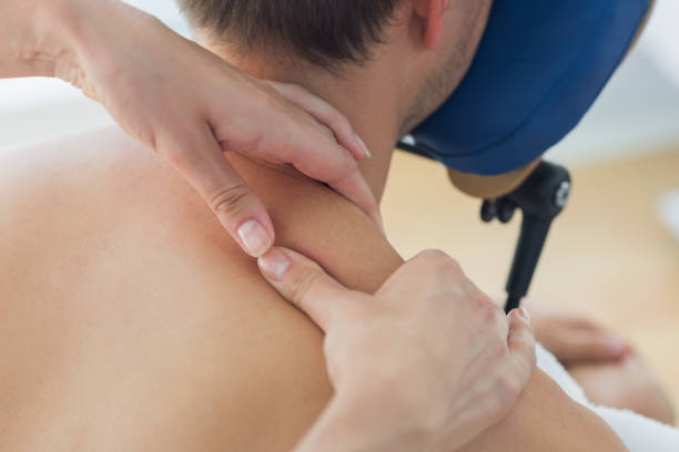 istock Man receiving shoulder massage by therapist 843270070