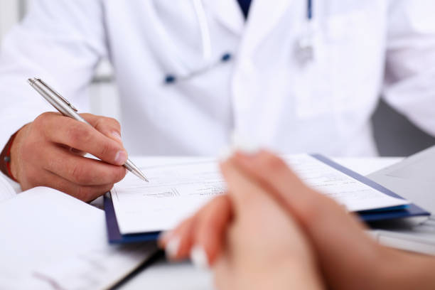 istock Male doctor arm hold silver pen 843270778