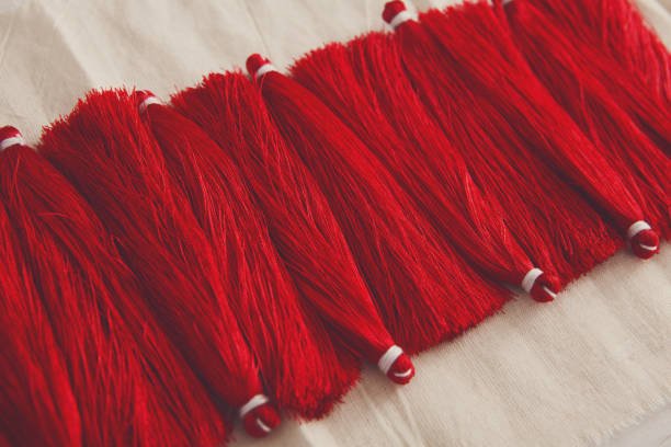 istock Red tassels line close up 843270916