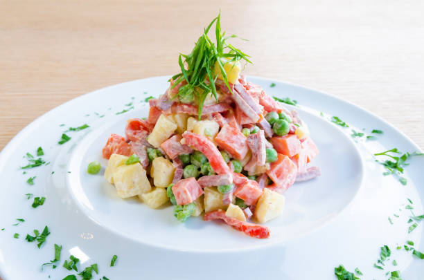 istock Traditional Russian delicious salad on a white plate 843271176