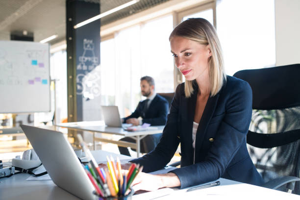 istock Two business people in the office working. 843281054