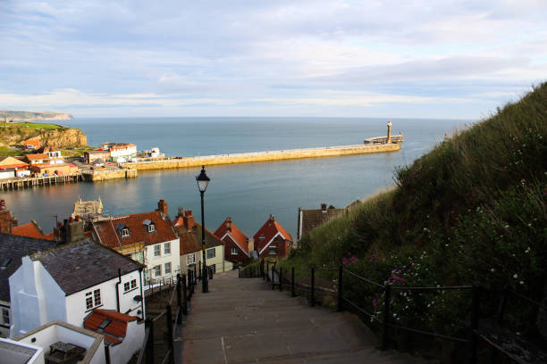 istock Whitby pier well lit - landscape 843285348