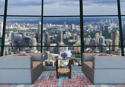 Lobby area of a hotel which can see abstract Blurred photo of cityscape background,Business financial concept