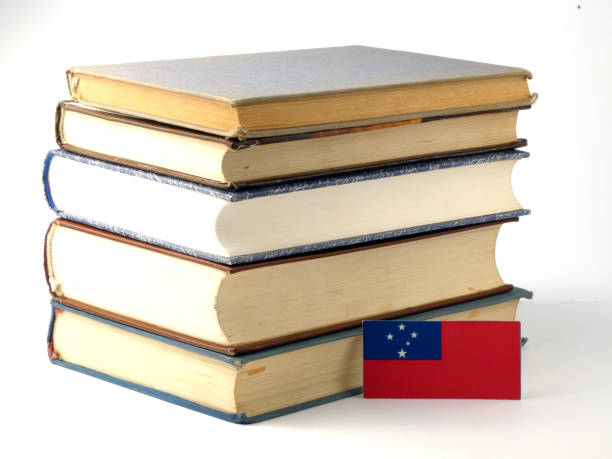 istock Samoa flag with pile of books isolated on white background 843290156