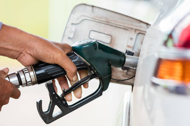 istock Male hand holding green pump 843290330