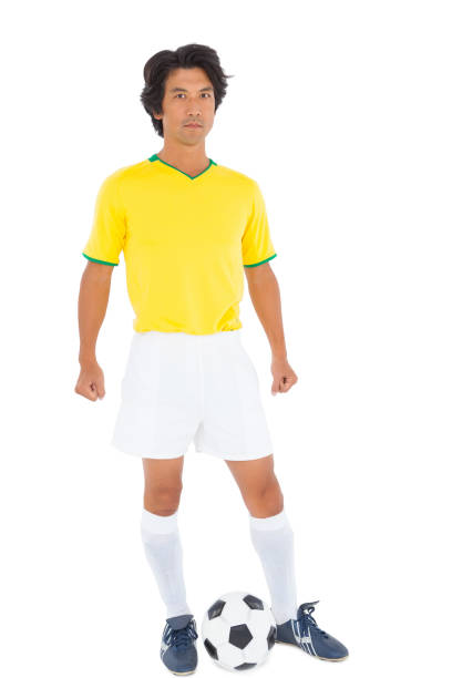 istock Football player in yellow with ball 843296814