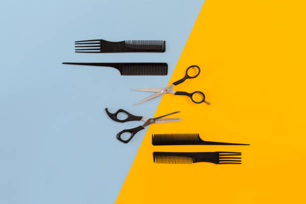 istock Hairdresser tools on blue and yellow background with copy space, top view, flat lay 843300708