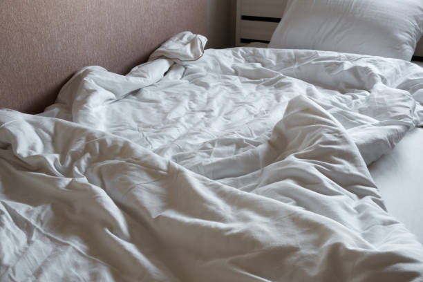 istock The white and clean blanket crumpled on bed 843301774