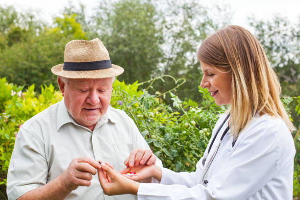 istock Doctor giving medication to elderly 843301994