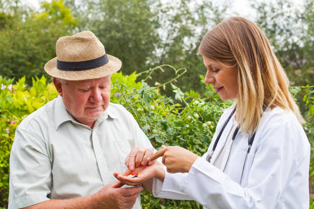 istock Doctor giving medication to elderly 843306066
